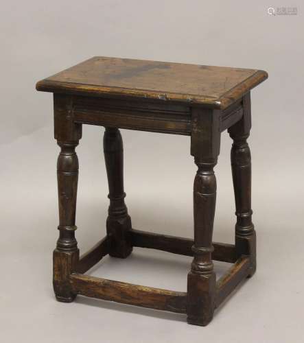 A 17TH CENTURY OAK JOINT STOOL, the rectangular top on turne...