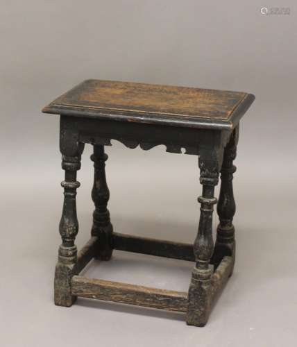 A CHARLES II STYLE OAK JOINT STOOL. A joint stool with a rec...