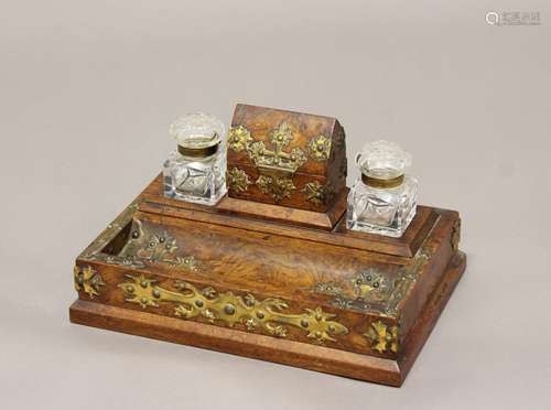 VICTORIAN BURR WALNUT AND GILT BRASS INKSTAND. A Victorian b...