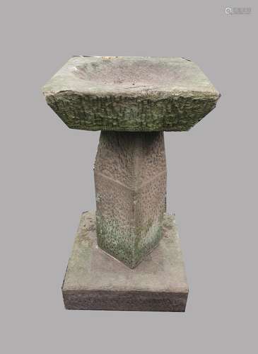 A CARVED STONE BIRD BATH. A composition stone bird bath with...