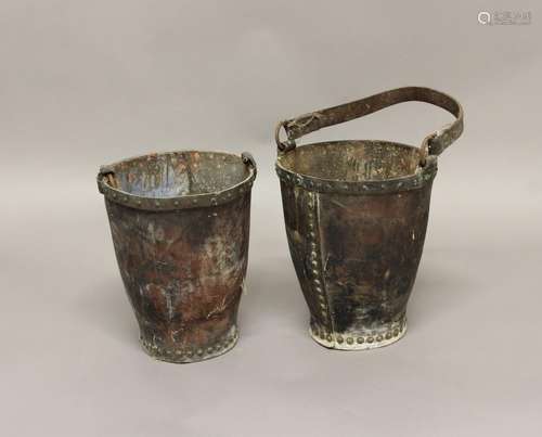 TWO SIMILAR LEATHER FIRE BUCKETS. Two fire buckets of rivete...