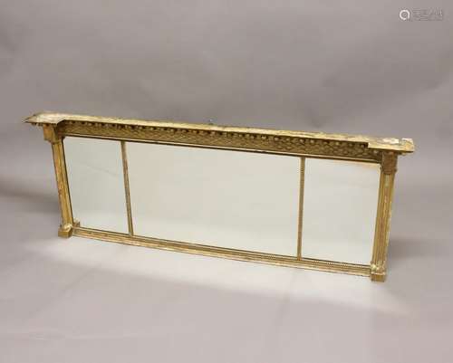 A 19TH CENTURY GILT OVERMANTEL MIRROR, the triple plate in a...