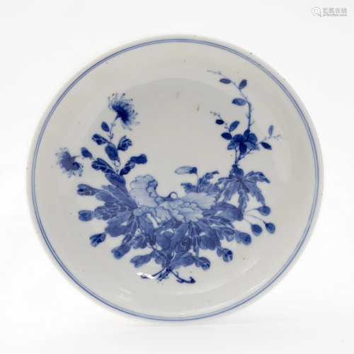 A BLUE AND WHITE PLATE