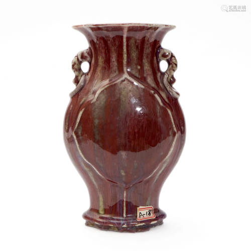 A RED-GLAZED BEGONIA-SHAPED BOTTLE WITH DOUBLE HAN…
