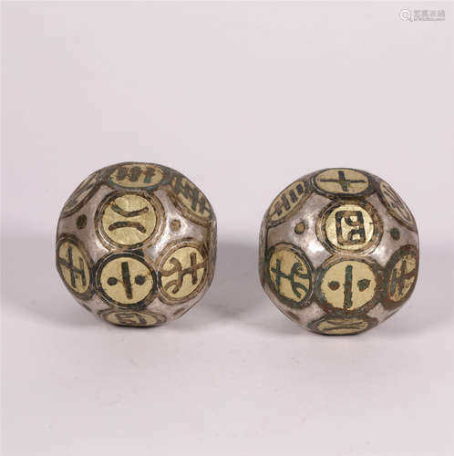 A PAIR OF BRONZE DICES