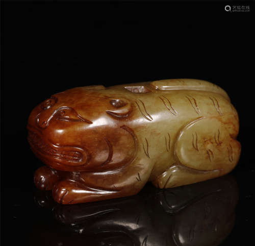 A YUAN STYLE JADE TIGER CROUCHING FIGURINE