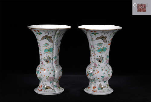 A PAIR OF FAMILLE ROSE PORCELAIN HUA GU FLOWER HOLDERS