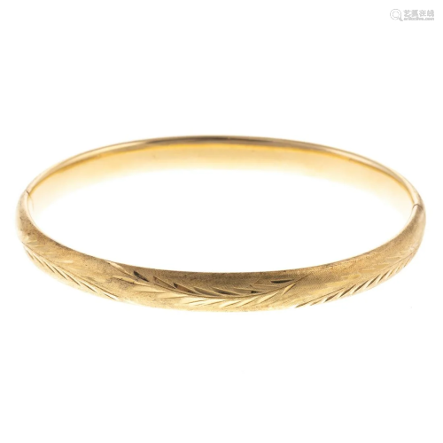 An Engraved Bangle in 14K Yellow Gold