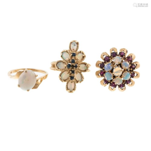 A Trio of Opal Rings in 18K & 14K Yellow Gold