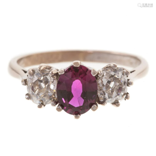 An Antique Oval Ruby & Old Mine Cut Diamond Ring