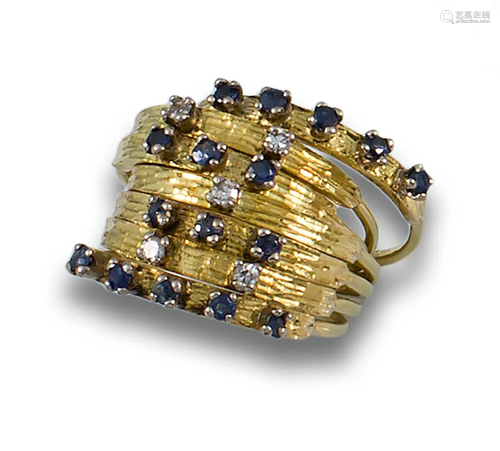 18kt yellow gold ring of the week type.