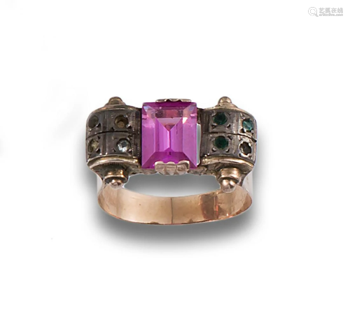 ring with pink central stone