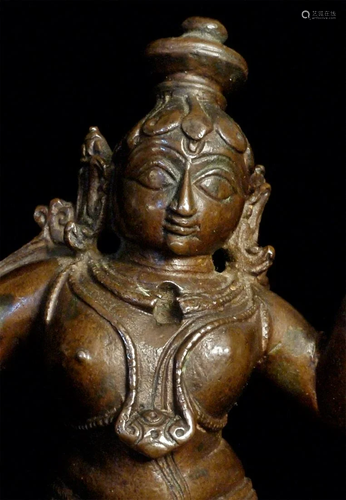 Early Hindu bronze figure with a butterball in each