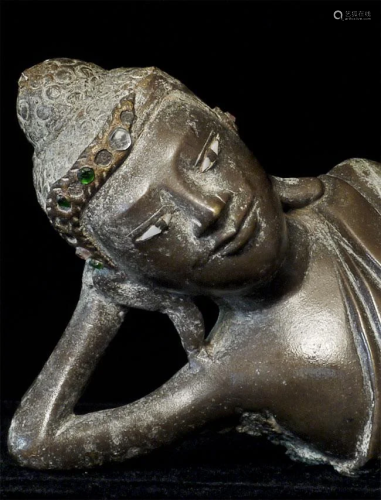 Reclining 19thC solid-cast reclining Burmese Buddha.
