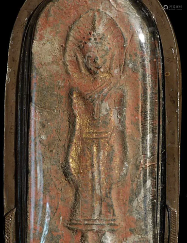 Large ancient Thai silver/lead amulet in a modern