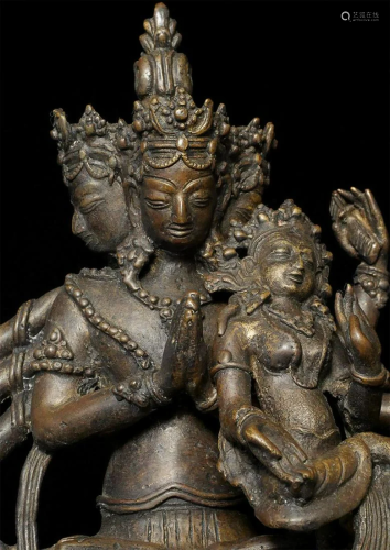 Antique Nepalese 4 headed Vishnu with consort.
