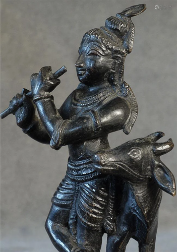 Vintage bronze Krishna with Nandi.