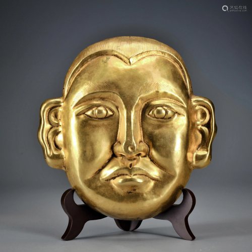 A Gilt-bronze Humanoid Mask