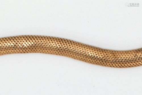 Bracelet « Serpent » en or jaune souple (9K), orné d’une tur...