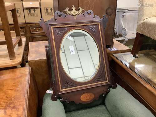 A George III style inlaid parcel gilt mahogany fret cut wall...