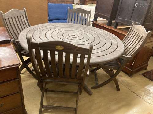 An Alexander Rose circular weathered teak garden table, diam...