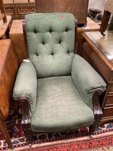 A Victorian mahogany framed armchair, in pale blue upholster...