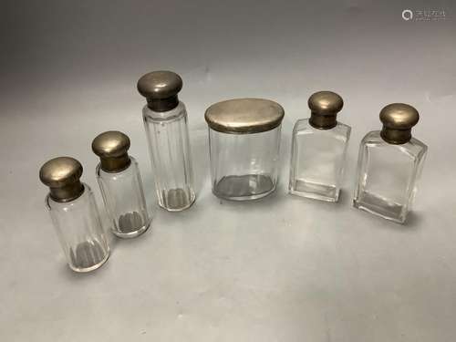 Six assorted silver mounted glass toilet jars, tallest 13.9c...