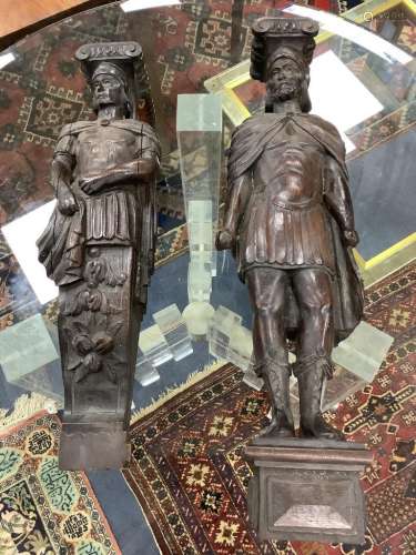 A 19th century pair of figural carvings