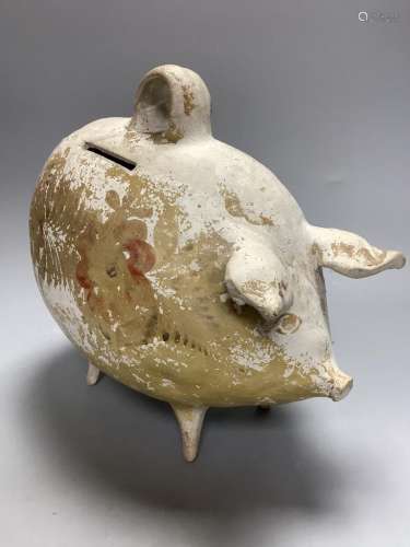 A French earthenware piggy bank, containing coins