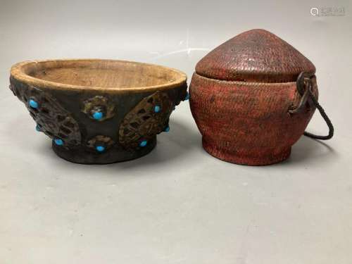 A Tibetan wooden bowl, diameter 13cm and a woven lidded bask...