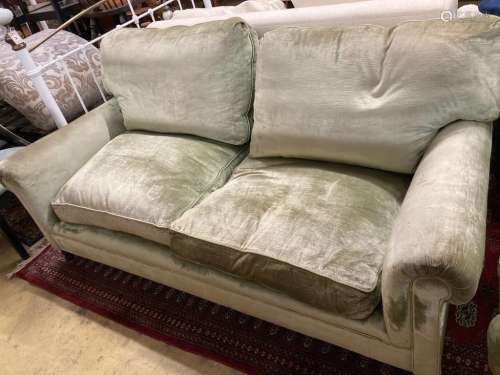 A George Smith two seater settee upholstered in pale green v...