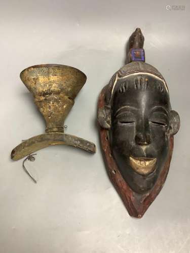 A tribal mask and a vessel