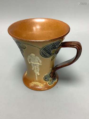 A Doulton Lambeth cycling related stoneware mug, c. 1900, he...