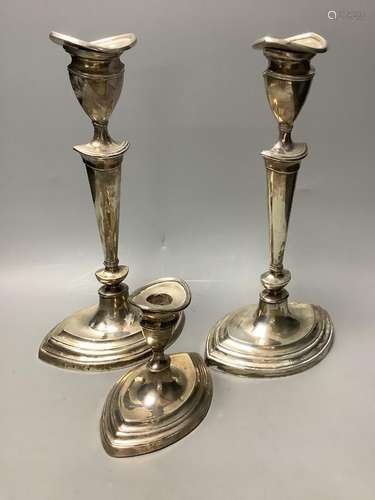 A pair of Mappin & Webb George III style silver candlesticks...