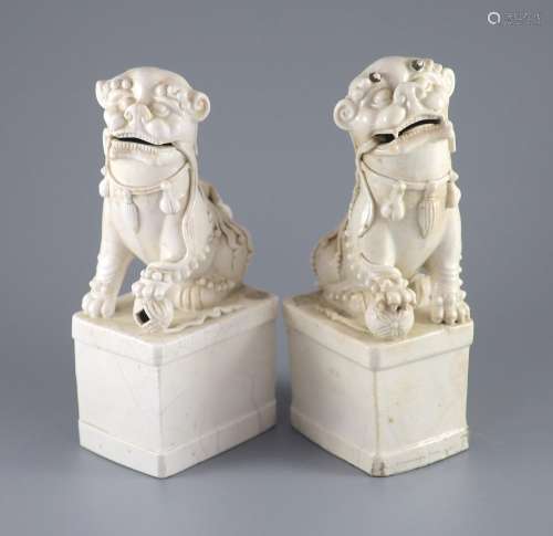 A pair of Chinese Dehua blanc de chine Buddhist lion joss st...