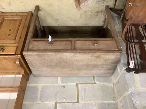 A Gordon Russell light oak two drawer side table, width 99cm...