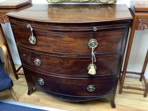 A late Georgian bow-fronted mahogany chest with brushing sli...