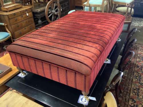 A large Victorian style rectangular upholstered footstool on...