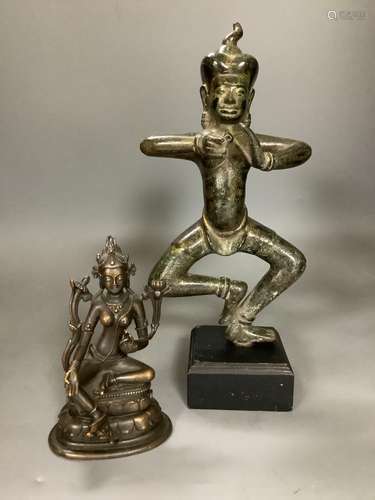 A Nepalese bronze figure of a deity, total height 33.5cm and...