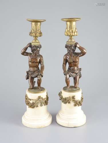 A pair of 19th century bronze and ormolu figural candlestick...