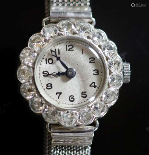 A lady's platinum and diamond set manual wind cocktail watch...