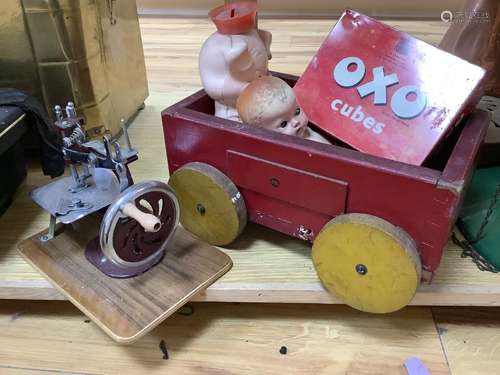 A vintage wooden truck, dolls, a children's sewing machine a...