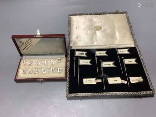 A cased set of twelve Dutch white metal number place setting...