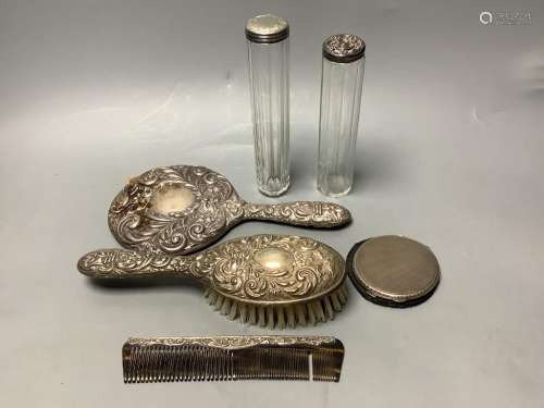 Two silver-topped narrow cylindrical toilet bottles, a silve...