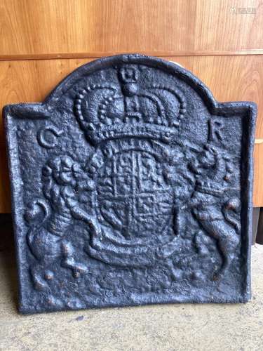 A heavy cast iron fireback, width 54cm, height 58cm