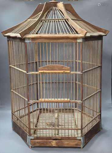 An hexagonal wood birdcage