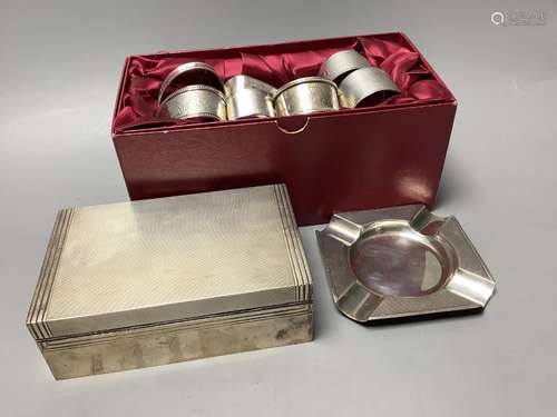 A presentation engine-turned silver cigarette box, a similar...