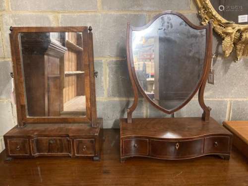 A shield-shaped mahogany toilet mirror with serpentine front...