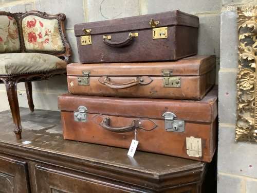 Three vintage leather suitcases, largest width 76cm, depth 4...