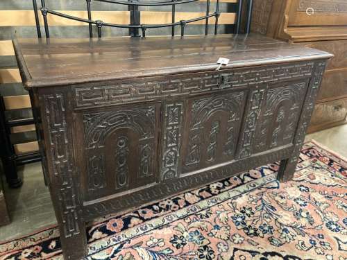 A 17th century carved oak cofferwith planked top, length 121...